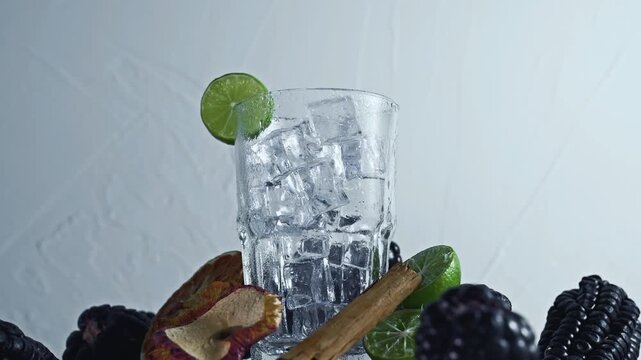 Pouring Chicha Morada, Purple Corn Drink with Lime and Cinnamon