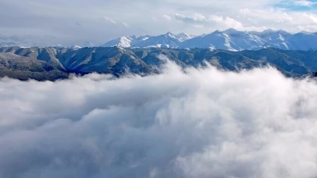 Mountain landscapes and scudding clouds captured a time-lapse drone. High views of foggy valleys