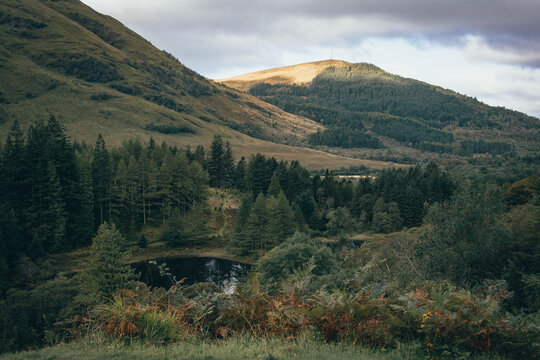 Hiking through the dramatic mountain pass of Glen Coe, Scottish Highlands