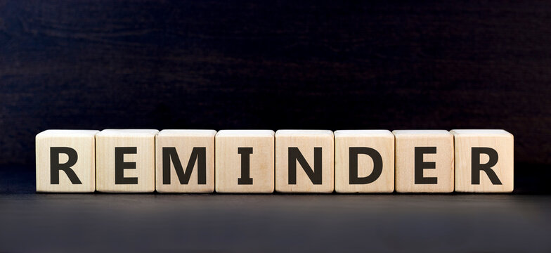 Reminder word symbol. Concept word Reminder on beautiful wooden blocks. Beautiful black background. Business support help reminder word concept. Copy space.