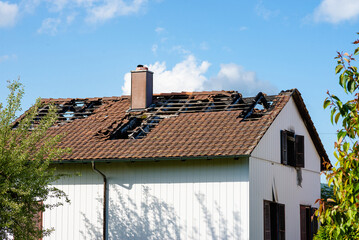 Fototapeta premium House Roof Damage with Broken Tiles