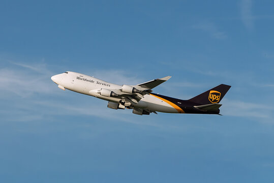 COLOGNE, GERMANY &mdash; MAY 28, 2026: A Boeing 747-8F cargo airplane operated by UPS Airlines takes off from Cologne Bonn Airport into a blue sky