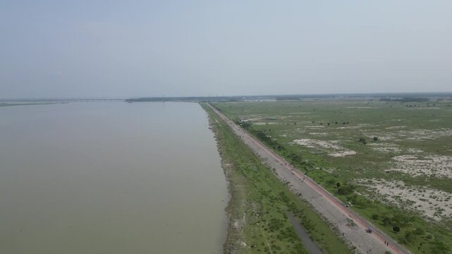 Wide drone view of Jamuna River and surrounding landscape Bangladesh 4K
