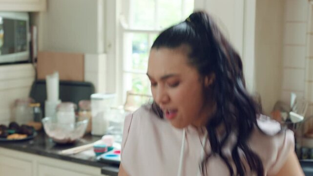 Happy, dance and woman cooking in kitchen with good mood, breakfast and healthy food at home. Excited, singing and person eating vegetables for nutrition, wellness and listening to music on weekend