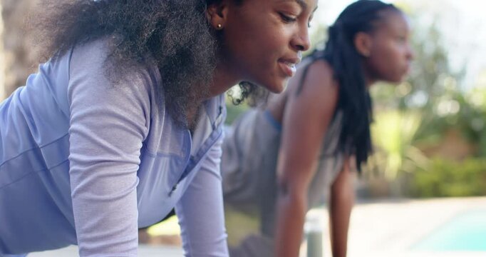 African American women starting plank on poolside mats for core strength, showing watch, copy space