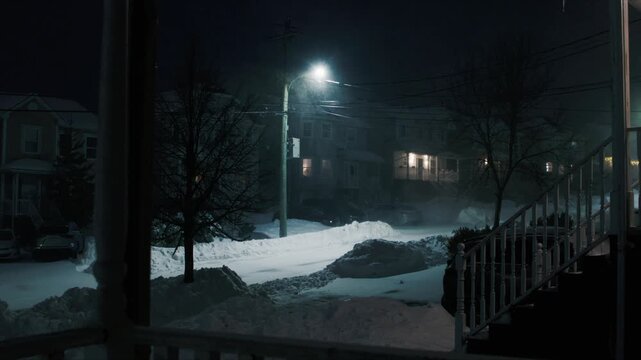 A powerful snow storm hits Beachville, Nova Scotia during a cold winter night. Strong winds and heavy snowfall create deep drifts, blocking roads and walkways in this quiet neighborhood