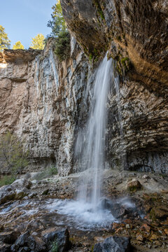 Long exposure image of Spouting Rock waterfall in White River National Forest, Colorado on clear sunny spring morning.