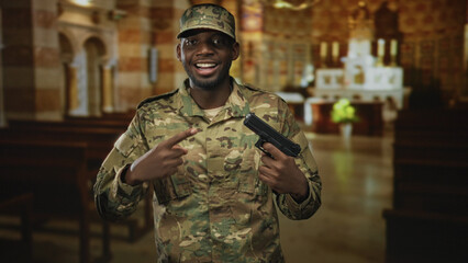 Obraz premium Man soldier points finger at gun while smiling inside a church building, wearing camouflage uniform and cap; pride duty.