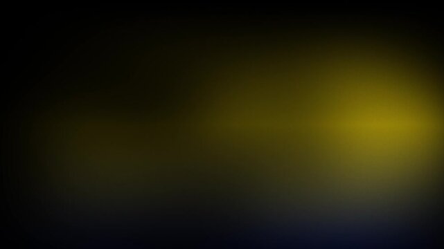 Animation abstract soft gradient light leaks loop motion background on black background. A bright yellow light on a dark background.
