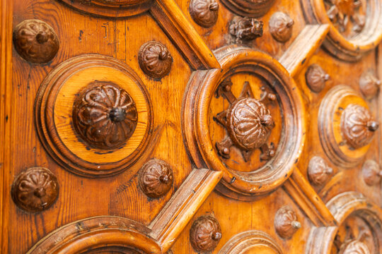 Close up of historic carved wooden door detail in Palau Maricel Sitges Spain