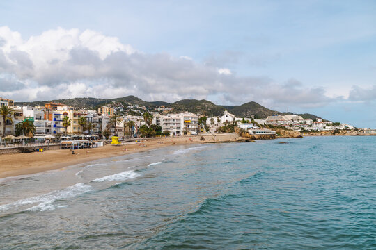 Sitges beachfront with Church of Sant Bartomeu and Santa Tecla on Mediterranean coast in Spain