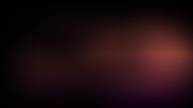 Animation abstract soft gradient light leaks loop motion background on black background. Blurry abstract background with orange light.
