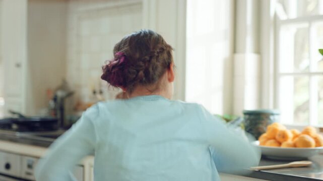 Fun, energy and child with dance in kitchen for childhood freedom, creative movement or development. Growth, girl kid and happy with rhythm in home for self expression, entertainment and wellness