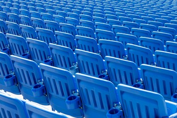Naklejka premium Rows of back of blue stadium seats 