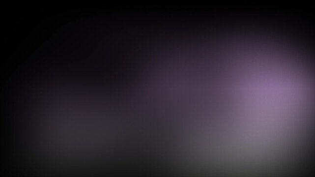 Animation abstract soft gradient light leaks loop motion background on black background. Blurry purple and gray spots on black.