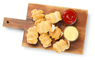 Naklejka premium Puff pastry. Tasty sausages in dough and sauces isolated on white, top view
