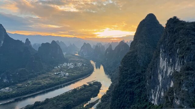 Drone flying over Li River and karst mountains in Yangshuo, China