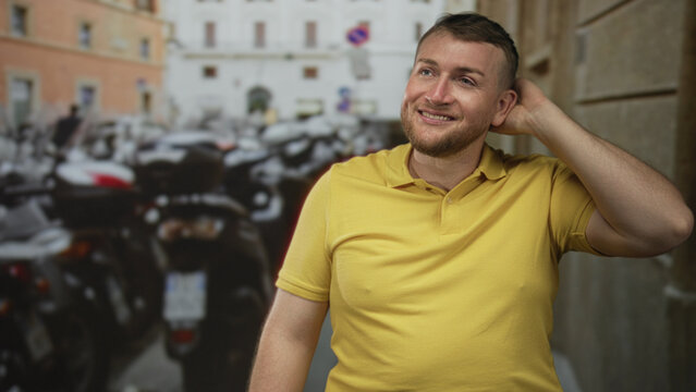 Man rubbing neck with hand on a busy street beside parked scooters, looking sideways with a shy grin; sheepish embarrassed smile.