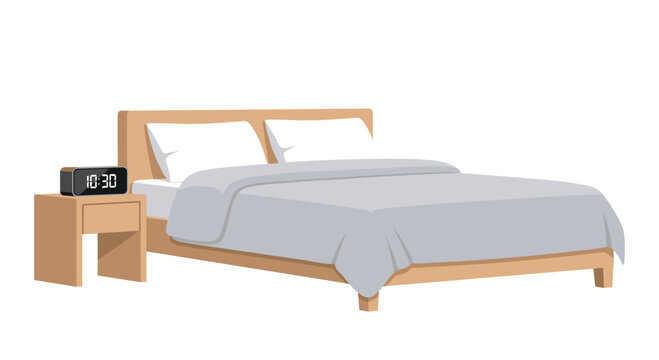 A simple minimalist bed with a grey blanket and two white pillows stands next to a wooden nightstand with a glowing digital clock in a clean bedroom.