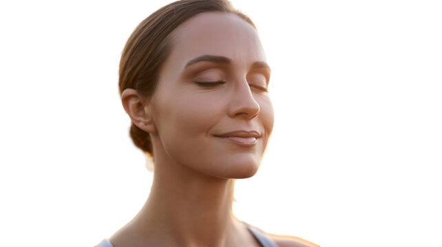 Serene woman with eyes closed, enjoying a peaceful moment, bathed in warm sunlight.