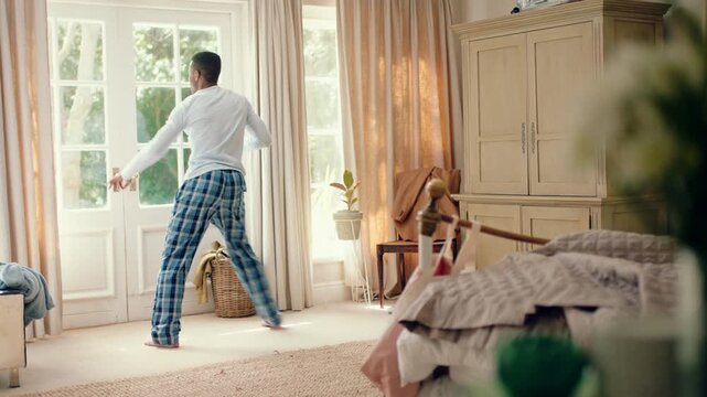 Dancing, rhythm and black man in home with energy for celebration, performance or practice. Happy, movement and male person with expression for hip hop, entertainment and morning fun in pyjamas