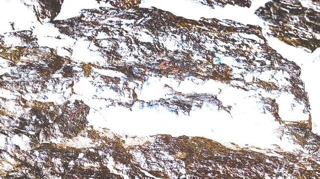 Abstract Bright High Contrast Rocky Mountain Texture Background with Snow Elements and Copy Space for Text