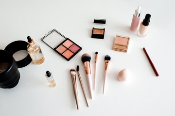 Sleek Collection Of Various Makeup Products Including Palettes, Bottles, And Brushes Arranged...