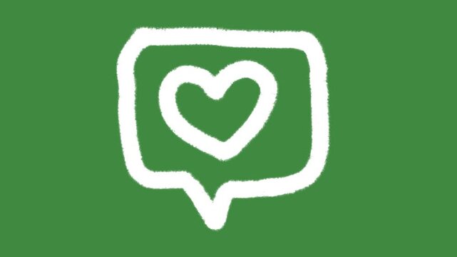White chalk speech bubble with heart outline icon drawn isolated on green screen chalkboard texture with hand-drawn love message balloon sketch element concept.