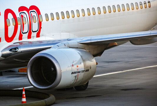 Close up detail of a Pegasus Boeing passenger jet engine and fuselage section
