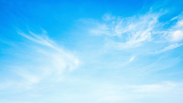 Beautiful vibrant blue sky background with colorful soft white clouds for inspirational nature wallpaper panorama mockup