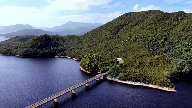 Scenic Burbury lake and Bradshaw bridge on Lyell Highway in Tasmania wilderness.
