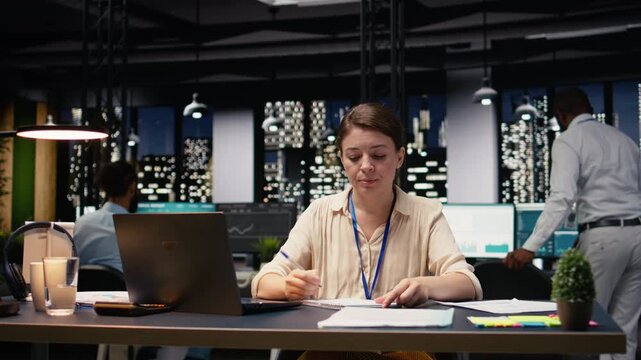 Overwhelmed woman tearing paper in frustration after making a mistake in administrative tasks. Manager feeling anxious and sad about poor performance metrics, pressure to deliver solutions.