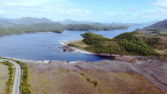 Long Burbury lake scenic aerial panorama Tasmanian wilderness mountains landscape.