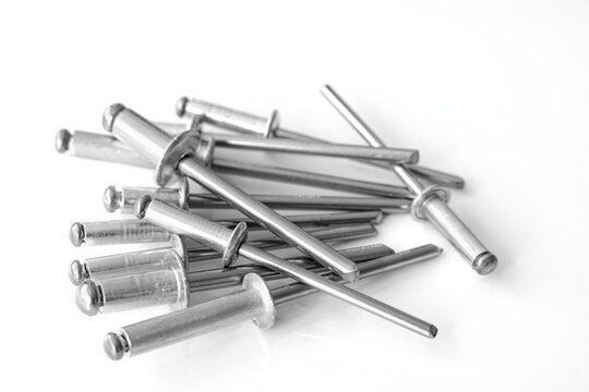 Pop rivets heap on a white background
