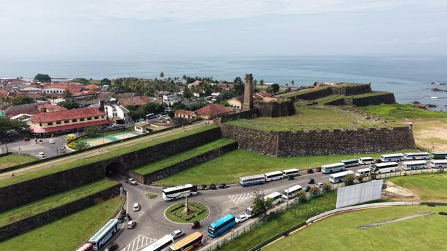 Aerial view of Galle Fort with its historic clock tower, stone ramparts, and old town rooftops by the ocean in Galle, Southern Province, Sri Lanka.