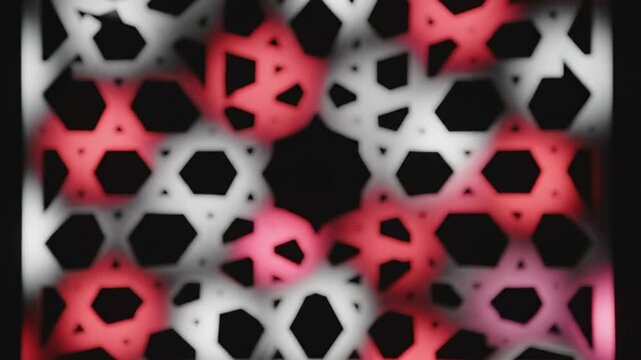 Abstract geometric pattern of interlocking star shapes creating a textured backdrop with blurred movement