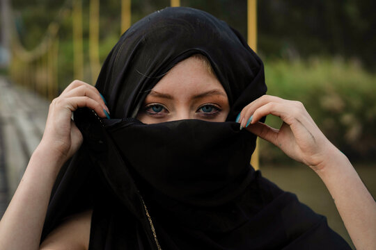Woman eyes looking out from black niqab