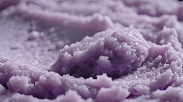 Closeup macro shot of purple mashed potatoes texture.
