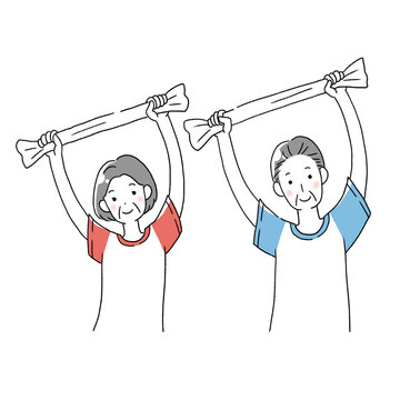 タオルで運動するシニア男性とシニア女性
