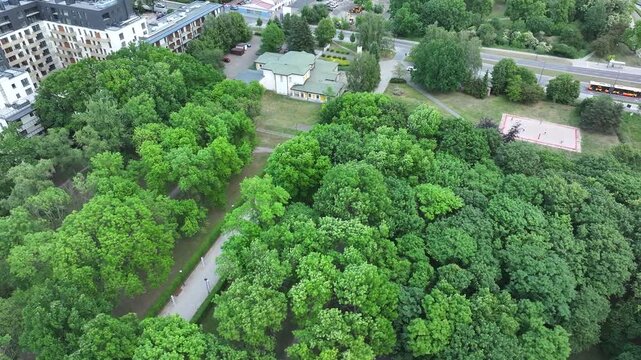 Aerial LDS Church city park Warsaw Poland 1 4K. Chapel the Church of Jesus Christ of Latter-day Saints. City center park. Religious headquarters. Royal Capital City of Warsaw in northern Poland.