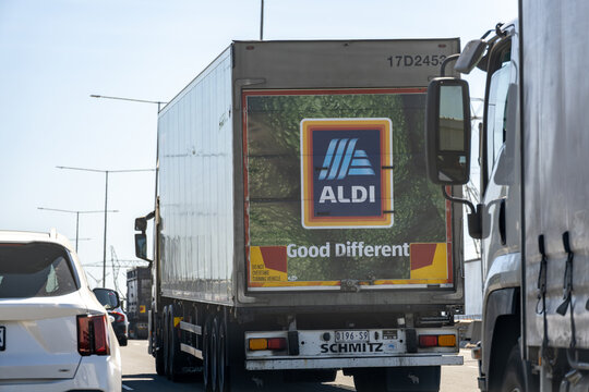 Aldi delivery truck with Good Different Slogan on busy highway traffic in Melbourne, Australia