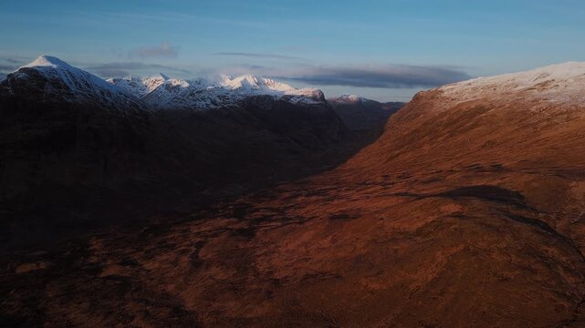 Drone flyover of winter mountain ridge in Glencoe Scotland