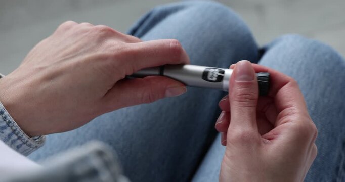 Diabetes. Woman with autoinjector at home, closeup