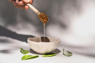 honey commercial photography, golden honey drizzle, premium honey advertising, natural sweetener concept, honey splash visuals, luxury food branding, organic honey product, golden nectar flow, gourmet © mansour