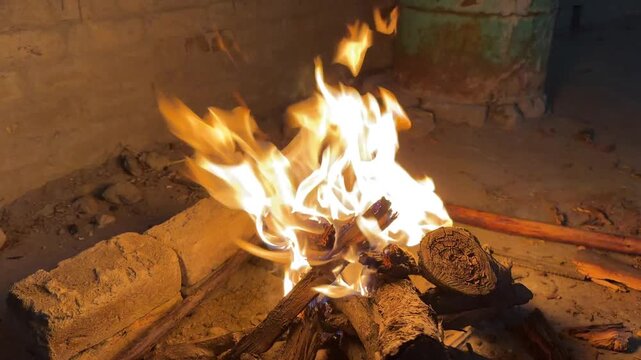 Glowing fire close‑up while celebrating Eid with barbecue outdoors.