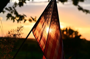 Fototapeta premium Sunset Over an American Flag