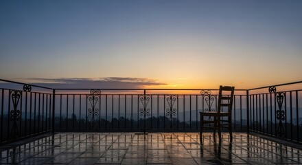 Fototapeta premium A balcony at dawn, with the first light of day breaking over the horizon, the space empty and peaceful, holding the promise of a new day.