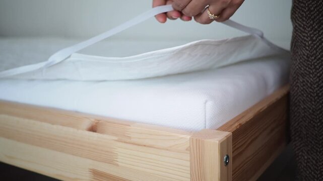 Installing a mattress on a wooden bed frame