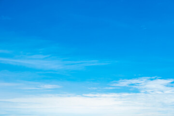 Obraz premium A bright, clear blue sky meets a glowing white horizon, suggesting a serene, open, and with sunlight of beautiful cloudy sky. landscape or abstract background 