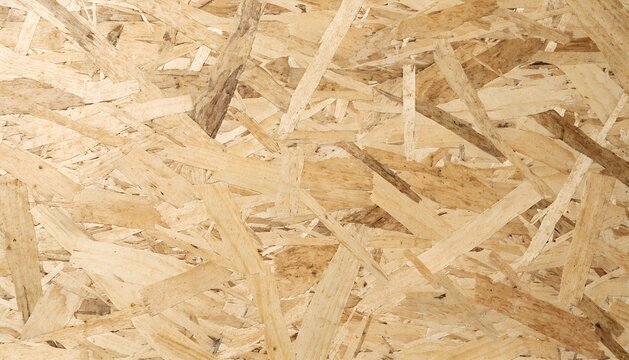 Close-up texture of oriented strand board wood grain in natural beige tone